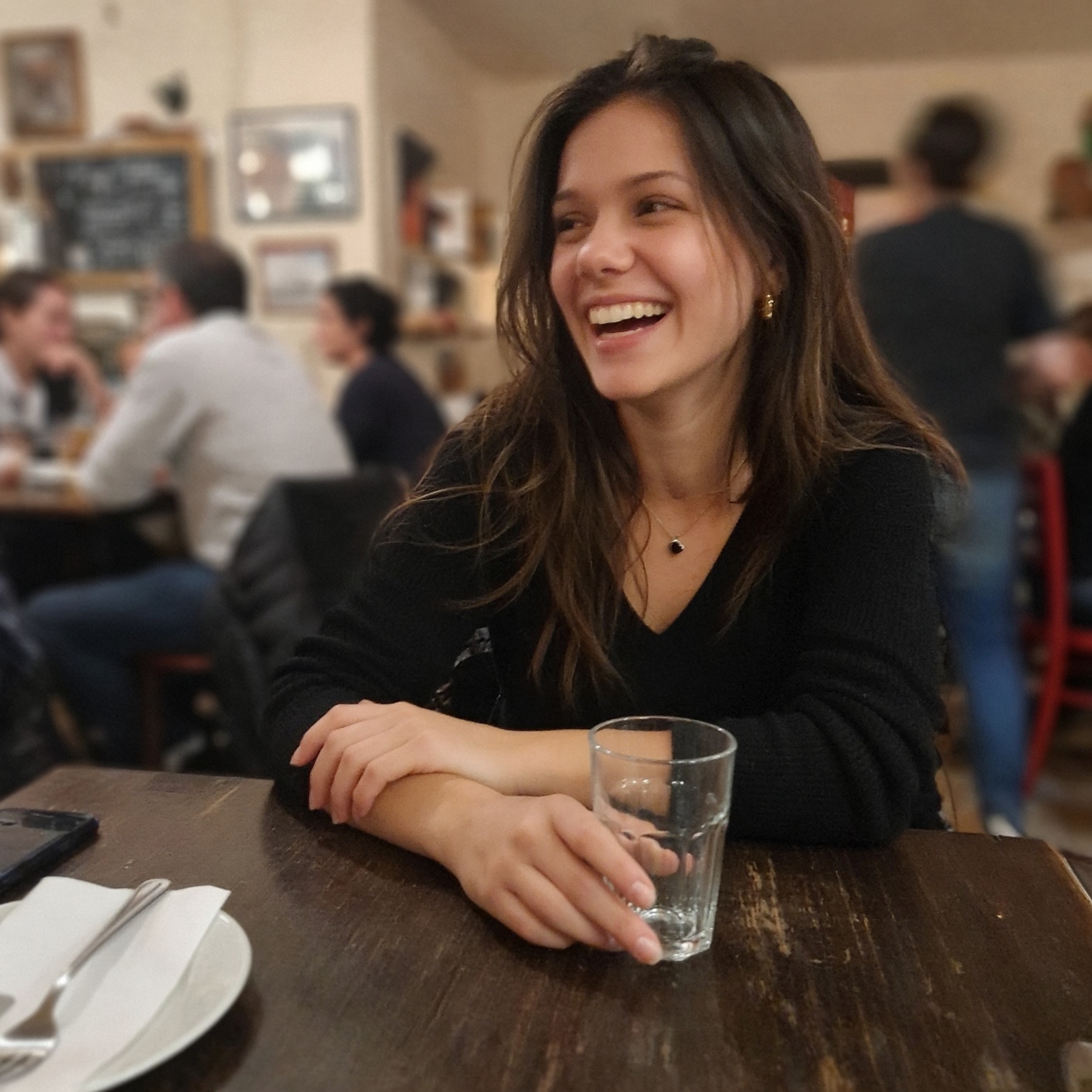 candid laugh across dinner table